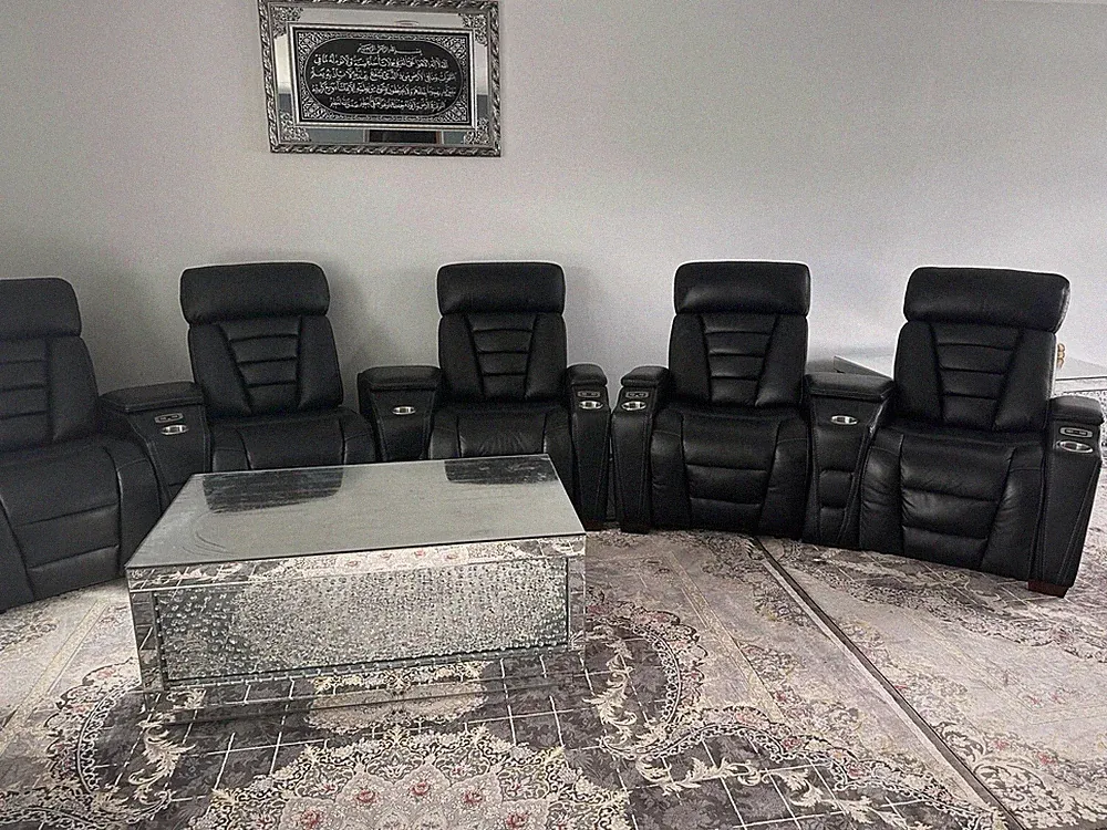 7 black leather recliners, used 6 months. Paid $5,300, selling for $3,500.