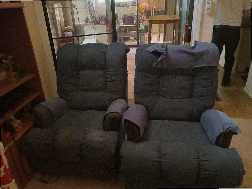 a pair of matching living room recliners